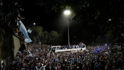 Fans welcome home the Argentine football team that defeated France on Sunday to win the World Cup. AFP