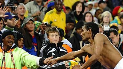 Florent Malouda shakes hands with a steward following France's Wolrd Cup exit on Tuesday.