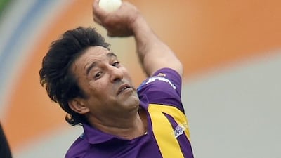 Former Pakistan bowling great Wasim Akram delivers a ball to Sachin’s Blaters batsman Curtly Ambrose during their T20 legends match in New York City on Saturday. Jewel Samad / AFP