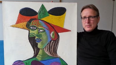 Dutch art detective Arthur Brand with 'Buste de Femme', a recovered Picasso painting. The painting was stolen from a wealthy Saudi Arabian's yacht 20 years ago. He has since returned the work, which he estimates to be worth some 25 million euros ($28 million) to an insurance company. Photo: AP