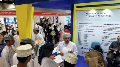 Omani graduates queue at the Job Exhibition in Muscat. Saleh Al-Shaibany for The National
