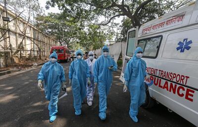 Health workers start their shift to attend to Covid-19 patients in Mumbai, India. South Asia's biggest economy is in the grips of a severe health crisis, which is likely to curtail oil demand. EPA