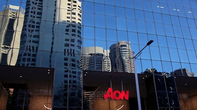 An Aon logo is reflected in a building in Sydney's Central Business District. The company's plan to create the world's biggest insurance broker through a takeover of London's Willis Towers Watson sparked an investigation by EU competition authorities. Reuters