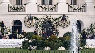 Workers complete final preparations for the ceremony. AP