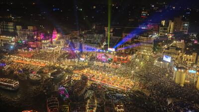 Thousands of devotees throng the River Ganga to watch a prayer ceremony during Dev Deepawali festival in Varanasi, India. AP