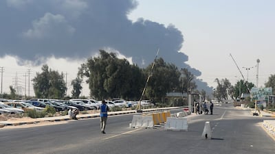 Smoke rises from a fire at the pipeline at Zubair oilfield, near Basra. Reuters