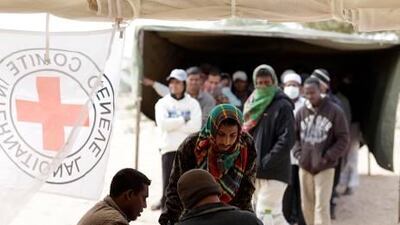 The UAE has provided aid to the refugees who have fled from Libya to Egypt and Tunisia for several months. Above, refugees stand in line to call their families at the Choucha refugee camp on the Tunisian-Libyan border in March.