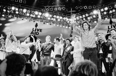 Performers on stage for the grand finale of the Live Aid concert at Wembley in 1985, led by Bob Geldof. Alamy