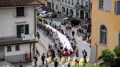 Measuring 70 metres long and 40 metres wide, these titans of trousers have a 16-metre zipper and are fastened by a button with a diameter of one metre. The wearer would need to be 180 metres tall. EPA