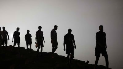 Migrants walk towards Fnideq in northern Morocco after leaving Ceuta, with tens of thousands having earlier crossed into Spain's North African enclave. AFP