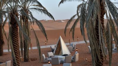 A lounge area amid rolling dunes at the "Riyadh Oasis." AFP