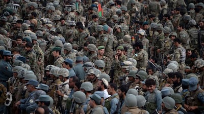 Afghan security personnel gather to leave the Khogyani district after a month long anti-Taliban operation in various parts of eastern Nangarhar province on August 30, 2015. Noorullah Shirzada/AFP Photo