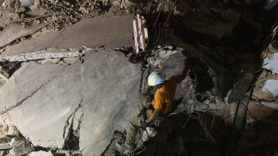 Rescue workers use a crane to lift concrete slabs from a destroyed building as they search for survivors in Beirut, Lebanon. A sniffer dog with a Chilean rescue crew responded to the presence of a person in the rubble of a building damaged in the deadly explosion on August 4. The condition of the person is unknown. Getty Images