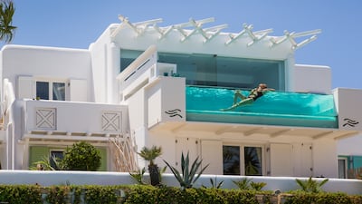 The hotel's signature suite has a private glass-fronted pool, which looks out over the bay. Photo: Kivotos Mykonos