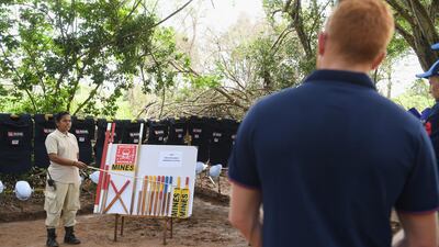 England player Jonny Bairstow watches a briefing during the England cricket team's visit to a de-mining event held by MAG. Getty Images