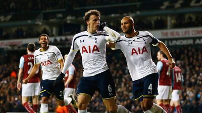 Vlad Chiriches, centre, celebrates Younes Kaboul after he scoring Tottenham's their third goal during the FA Cup Third Round replay againsy Burnley at White Hart Lane on January 14. Julian Finney / Getty Images