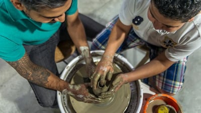 Jan 15, 2017 - Potters at Yadawei Pottery Studio shape a pot on a clay wheel. Courtesy of Yadawei Pottery Studio