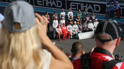 The F1 drivers pose for end of season group photo. Al Haider / EPA