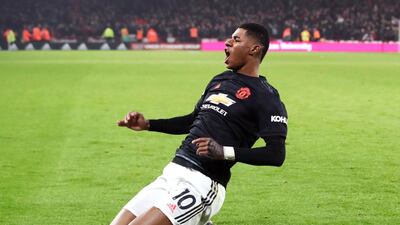 Manchester United's Marcus Rashford celebrates after scoring his side's third goal. PA