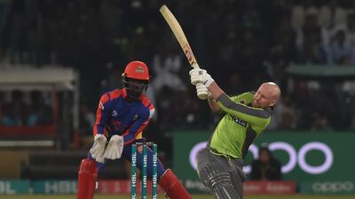 Lahore Qalandars's Ben Dunk (R) hits a shot aagainst Karachi Kings. AFP