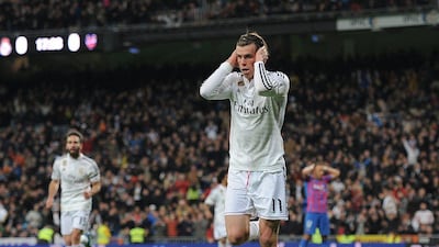 Gareth Bale covers his ears in celebration after scoring the first of his two goals in Real Madrid's victory over Levante. Dennis Doyle / Getty