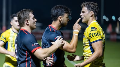 Francois Myburgh of Dubai Exiles argues with Matt Gilham of Dubai Hurricanes.