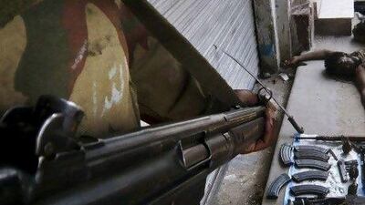 Pakistani soldiers with weapons confiscated after a shootout which killed four militants in the Swat Valley. As firing squad footage and other scandals suggest, the army remains largely unwilling to hold itself accountable to the public.