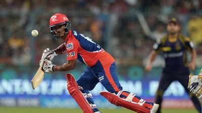 Delhi Daredevils cricketer Pawan Negi plays a shot. AFP / Dibyangshu SARKAR
