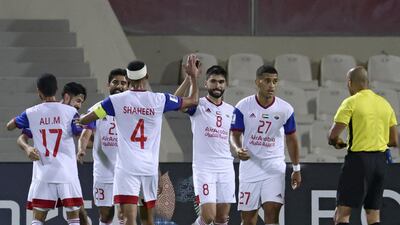 Sharjah's players celebrate after Khalid Bawazir scores the decisive goal in the Asian Champions League Group B match against Air Force Club. AFP