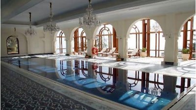East India Hotels, a hospitality major that operates the Oberoi group of hotels, sold a 14.2 per cent stake to Reliance Industries for 10.21bn rupees. Above, The indoor swimming pool at Oberoi's Wildflower Hall in Shimla, India. Adam Majendie/Bloomberg News.