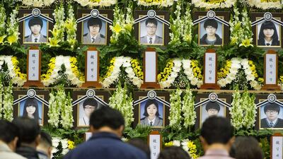 People attend a memorial for the victims of the South Korean ferry disaster. Kim Do-hoo / AFP Photo April 24
