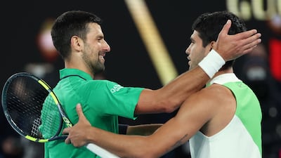 Novak Djokovic congratulates Carlos Alcaraz after his four-set victory. AFP
