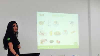 Kcal nutritionist Dona Maria Mesmar talks about what makes up a healthy diet during a Healthy Living Workshop at Abu Dhabi Media. Evelyn Lau / The National