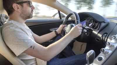 The dials on the right of the picture, above the gearstick, can be set to display the maximum outputs of your drive. Bugatti Automobiles SAS