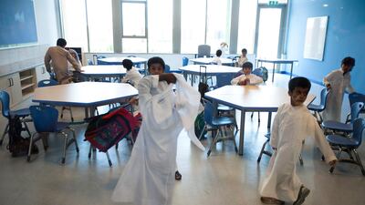 Al Ain, September 11, 2011: Students come back to class after eating lunch during the first day of classes at Mezyad School in Al Ain. (Andrew Henderson / The National)