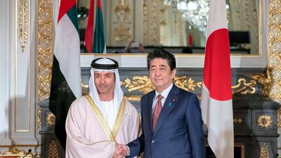 Sheikh Hazza bin Zayed, Vice Chairman of the Abu Dhabi Executive Council, stands for a photograph with Shinzo Abe, Prime Minister of Japan. Rashed Al Mansoori / Ministry of Presidential Affairs