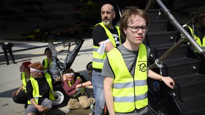 Environmental activists engage in a climate protest at the European Business Aviation Convention and Exhibition at Geneva Airport in Switzerland. EPA