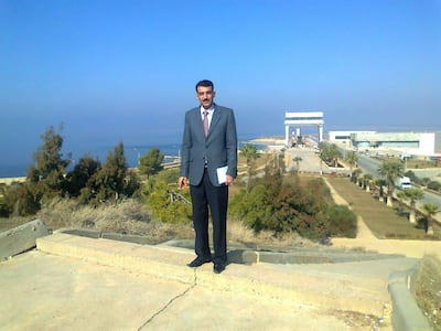 Abdulrazzak Al Aliewi stands at the Euphrates Dam in central Syria in 2009, while working at the land reclamation authority. He emigrated to Germany after civil war broke out in 2011. Photo: Abdulrazzak Al Aliewi