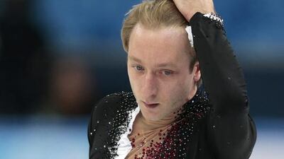 Evgeni Plushenko of Russia skates prior to pulling out of the men's short programme figure skating competition on Thursday. Ivan Sekretarev / AP Photo