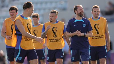 England manager Gareth Southgate enjoys a joke at training. EPA