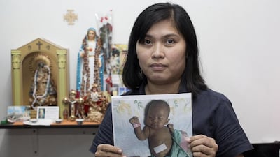 Grace Carungay will return to work in Abu Dhabi to pay for the lifelong care of her one-year-old daughter, Aleeyah, who has made remarkable progress after a liver transplant. Irene García León for The National