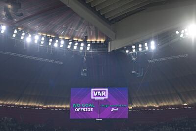 A giant screen displays the VAR offside goal during the Qatar 2022 World Cup Group A match between Qatar and Ecuador at the Al Bayt Stadium. AFP