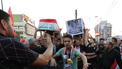 Iraqis carry the coffins of two protesters who were killed by security forces during funeral procession at Tahrir square in central Baghdad, Iraq. EPA
