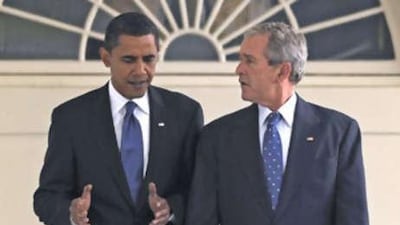The US president-elect, Barack Obama, is led by the US president George W Bush, right, through the Colonnade during a welcome ceremony at the White House in Washington, DC, Nov 11 2008.