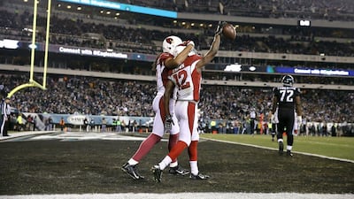 Arizona Cardinals players John Brown, right, and Larry Fitzgerald celebrate after a touchdown against the Philadelphia Eagles on Sunday in the NFL. Matt Rourke / AP / December 20, 2015