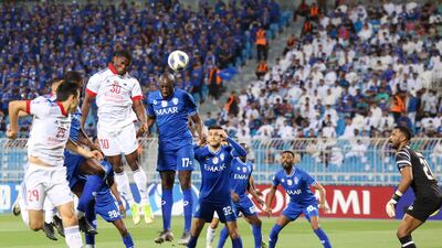 Sharjah forward Ousmane Camara heads the ball to score the opening goal.