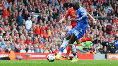 Chelsea’s French-born Senegalese striker Demba Ba shoots to score the opening goal during the English Premier League football match between Liverpool and Chelsea at Anfield Stadium in Liverpool, northwest England, on April 27, 2014. AFP PHOTO / ANDREW YATES