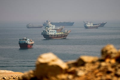 Ships wait near the Strait of Hormuz, which has been closed by Iran during the war. Reuters
