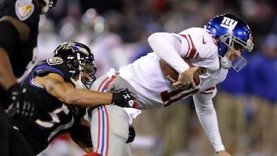 The Baltimore Ravens' defence made things tough on the New York Giants and quarterback Eli Manning, right.