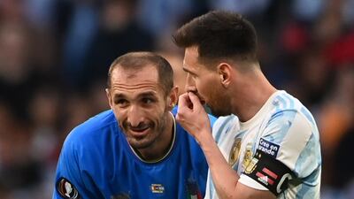 Lionel Messi talks to Giorgio Chiellini. EPA